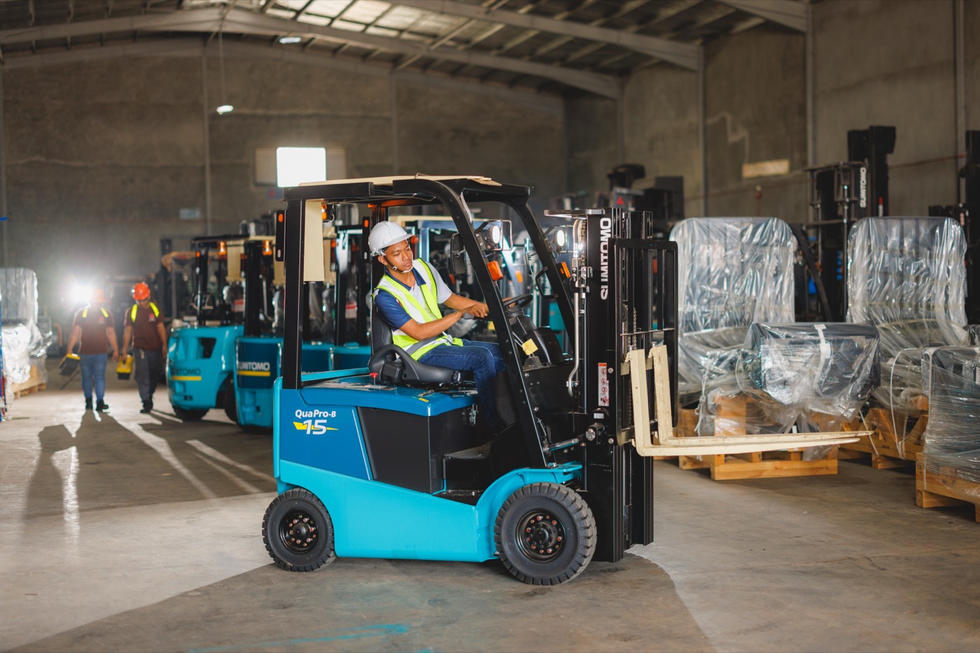 GEMHI Sumitomo electric forklift operating in a warehouse
